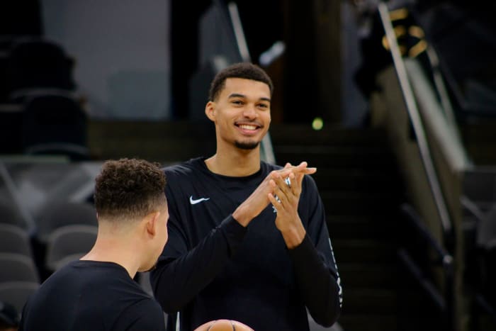 Jan 4, 2024; San Antonio, Texas, USA; San Antonio Spurs rookie Victor Wembanyama (1) smiles while fans sing him 'Happy Birthday' prior to facing the Milwaukee Bucks.